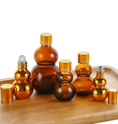 Customizable Premium 10ml/50ml/100ml Amber Glass Perfume Oil Roll On Bottles With Golden Mirror Finish‌ Dual Golden Caps & Thickened Base‌